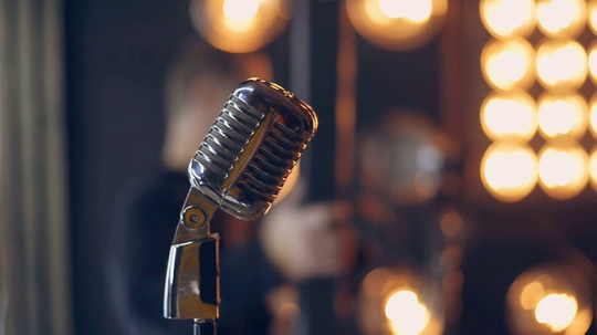 Microphone-in-foreground-with-blurred-background.jpg