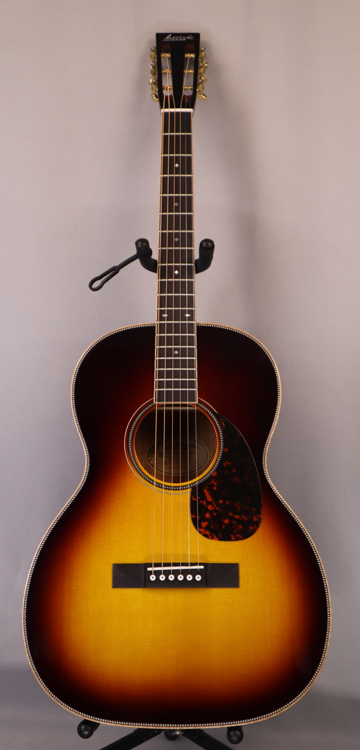 Larrivee OOO-50 (Full Sunburst) Slotted Headstock, 12-Fret. Solid Sitka Spruce Top, Solid Mahogany back and sides.